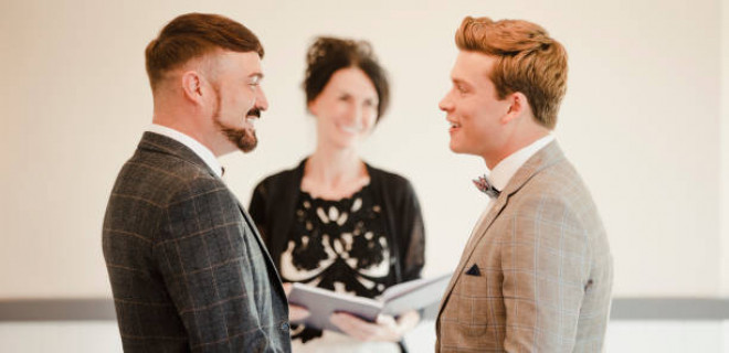 Two newly married men in front of registrar