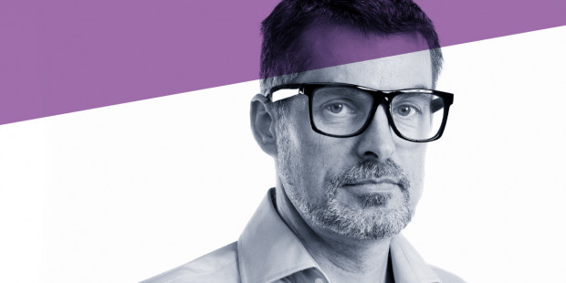 Man with glasses with counselling purple branding