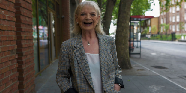 A smiling elderly woman.