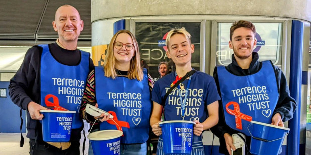 Bucket collection by four Terrence Higgins Trust people at Canary Wharf station
