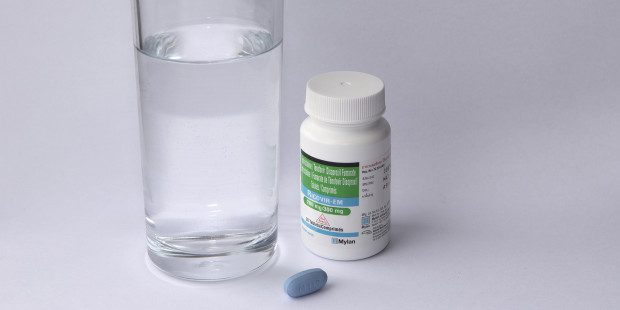 Ricovir PrEP pill and bottle with glass of water