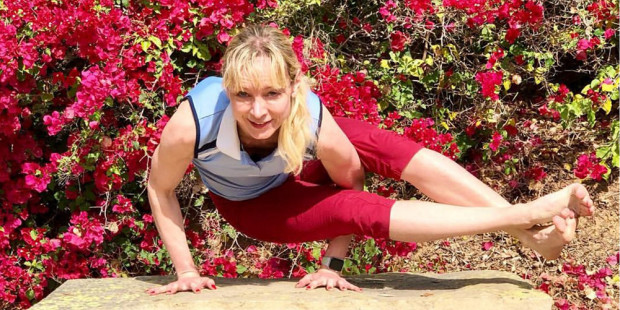 Volunteer Sabrina Jacobs doing yoga