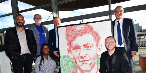 40 years of HIV at the Welsh Senedd group photo and Terry Higgins painting