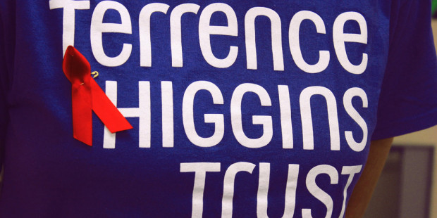 A blue Terrence Higgins T-shirt with a red ribbon for World AIDS Day.