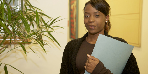 Woman holding a document file