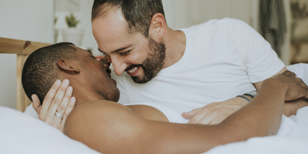 Male couple in bed
