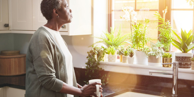 Woman standing at sink