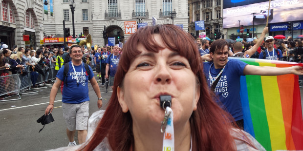 Woman blowing whistle at London Pride