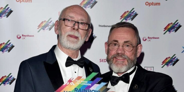 Martyn Butler OBE and Rupert Whitaker OBE holding award