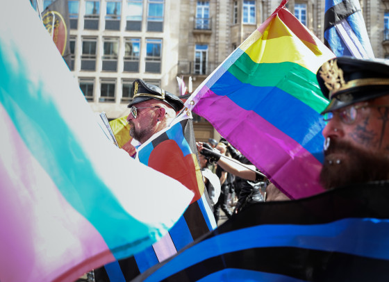 A march with prominent Pride flags.