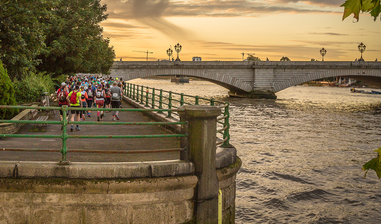 Thames Path Challenge bridge sunset with walkers Thames Path Challenge bridge sunset with walkers