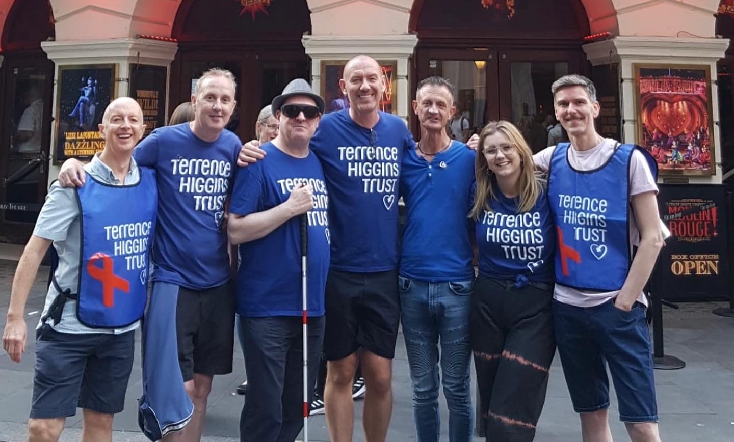 A group of Terrence Higgins Trust fundraisers outside a West End theatre.