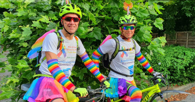 Cyclists in rainbow gear